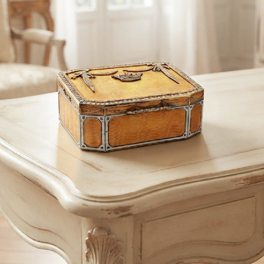 Antique late 19th-century European guilloché enamel box with paste stones on a cream French desk 