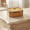 Antique late 19th-century European guilloché enamel box with paste stones on a cream French desk 