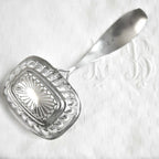 Exceptional early 19th-century sterling silver sugar sifter, 6‑1/2" x 3" x 2‑1/4", rare and collectible. Perfect for elegant table settings or luxury collections.