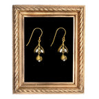 Eucalyptus pearl wire earrings in bronze with soft gold wash and lustrous freshwater pearls, hand-cast from real seed cluster