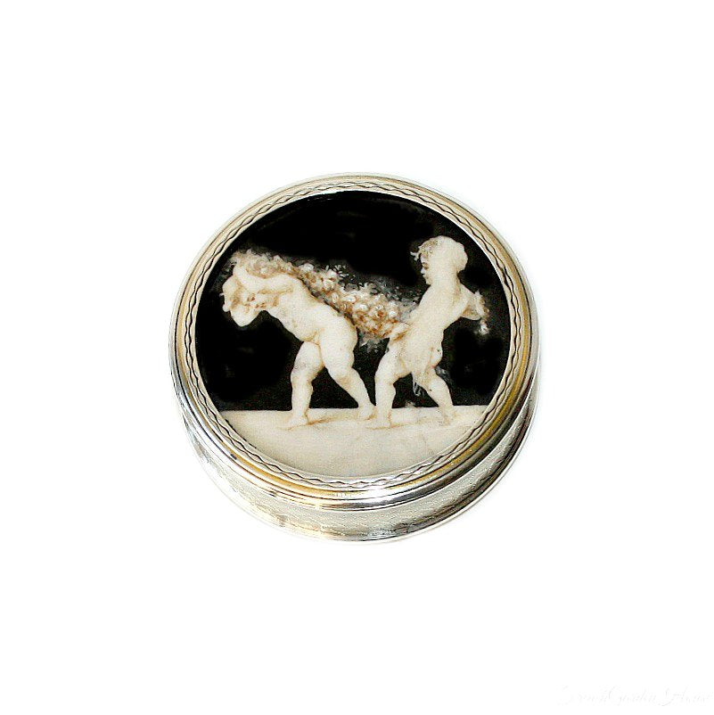 Antique French vermeil miniature box with cherubs and ose garlands top view