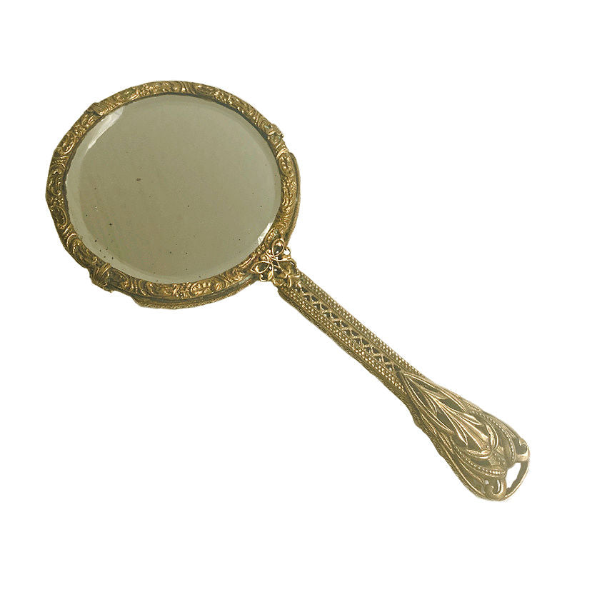 Gold jeweled filigree hand mirror adorned with emerald green glass cabochons. A romantic antique vanity treasure of exceptional elegance and charm.