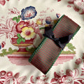 Merlot Piquot burgundy and green French wired ribbon on antique plate