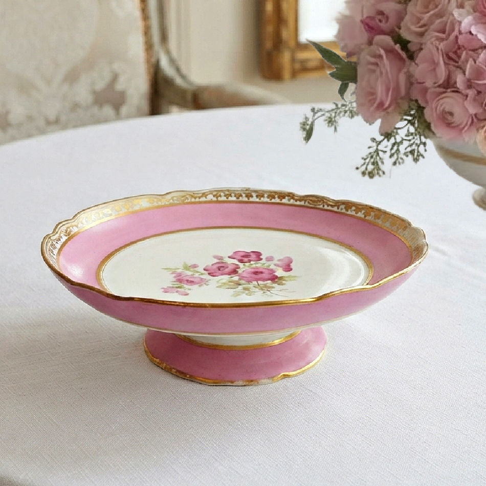 Antique Old Paris hand-painted pink floral cake stand styled on an elegant French dining table