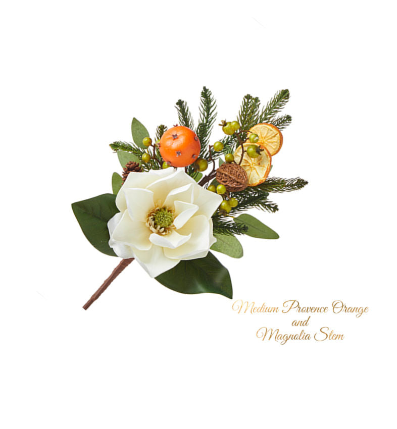 A medium-sized artificial flora depicting a Provence orange and magnolia stem, filled with an orange pomander, berries, and green leaves.