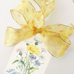 Modern French orange ribbon with playful polka dot design