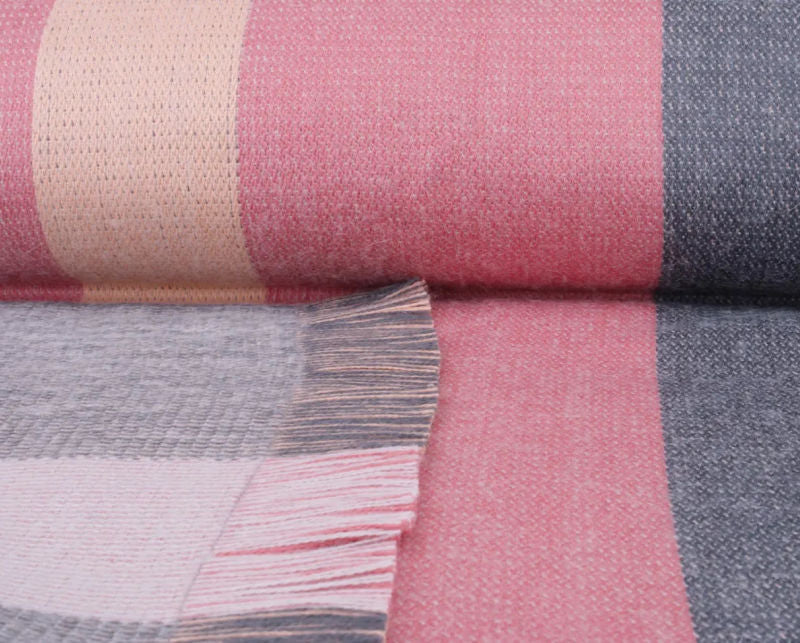 detail of alpaca wool throw in pinks for luxury decorating