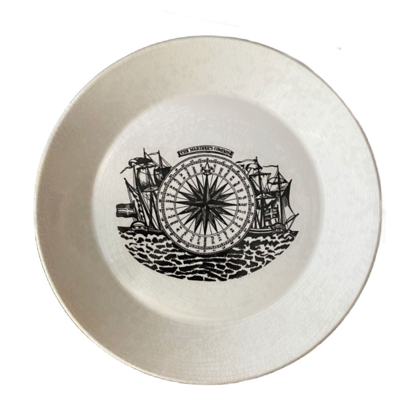 Close-up of Mariner’s Compass plate with ship design