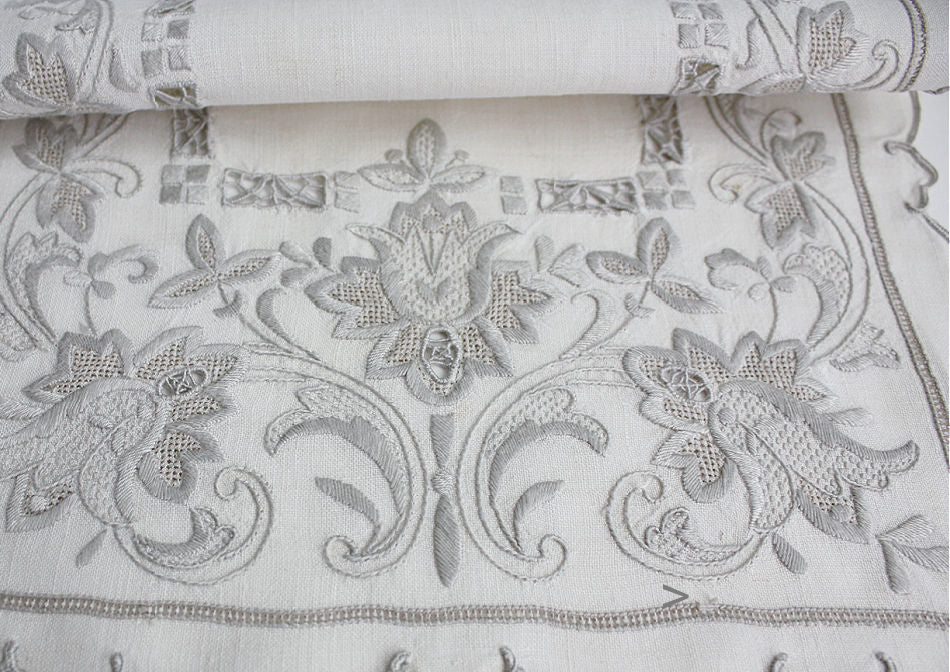 Antique hand embroidered linen table setting for six with tulip embroidery- showing detail of embroidery work