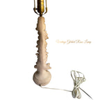 Decorative vintage lamp base featuring sculpted roses and classical column form back view