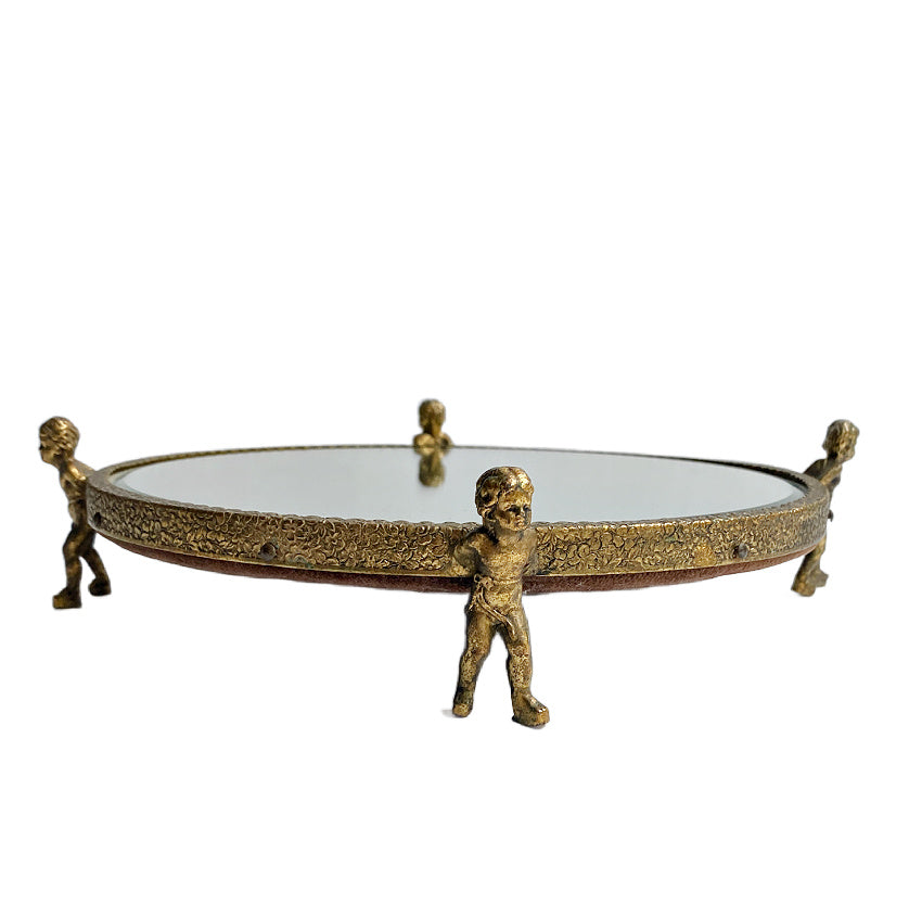 Vintage gilded cherub beveled mirror vanity pedestal, 9&quot;. Four cherub feet support a round beveled mirror—perfect for perfume, jewelry, and French boudoir décor.