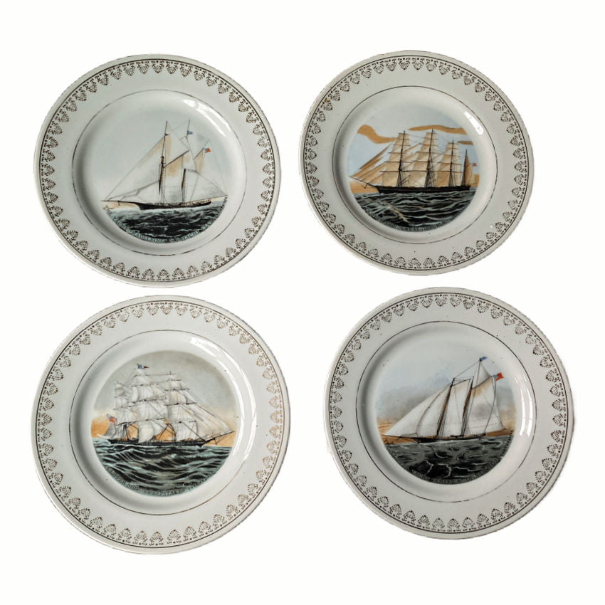 Four porcelain sailing ship plates for  a coastal wall art with gilt rims