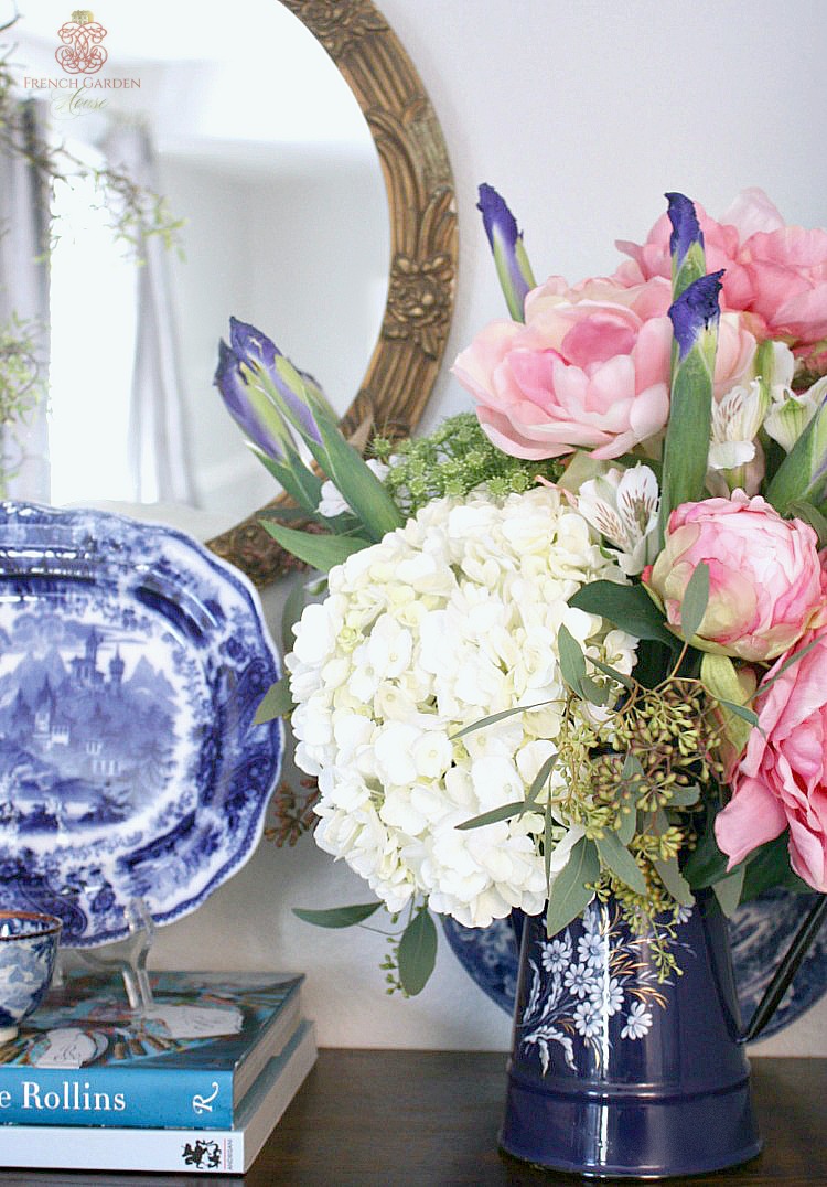 antique french enamel pot filled with hydrangea, pink peonies