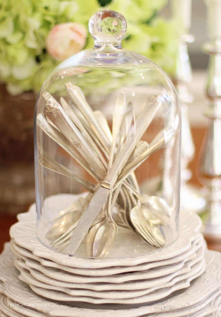 antique silverware in cloche