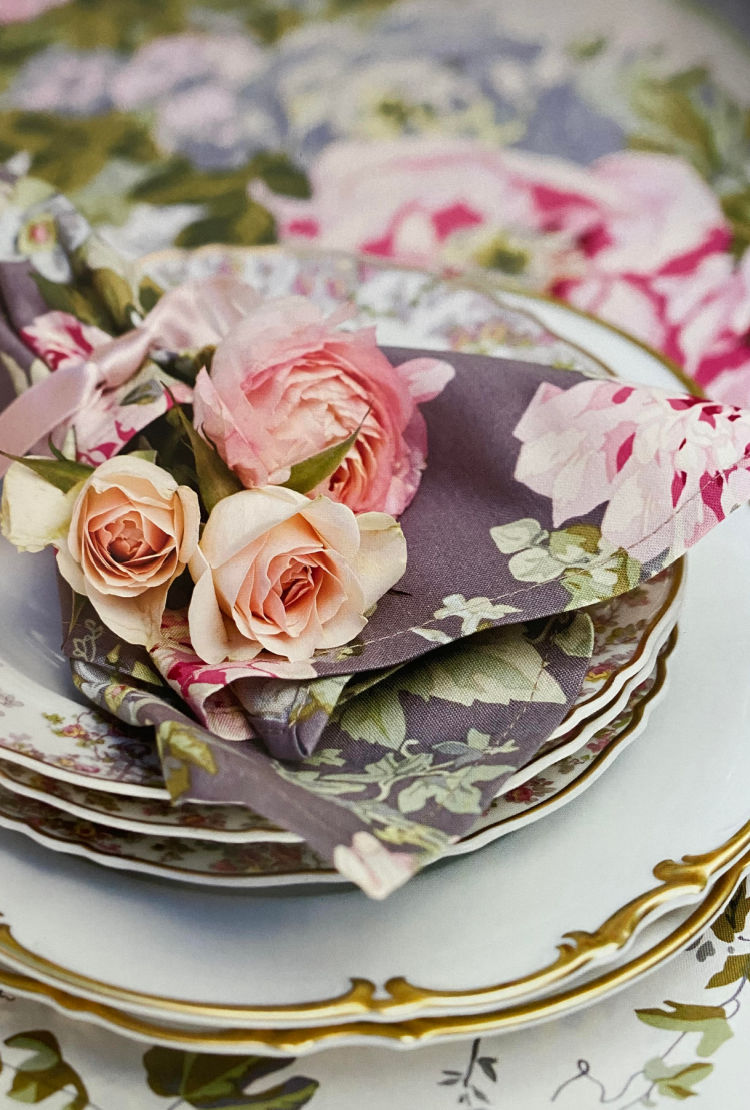 spring table with rose filled linens