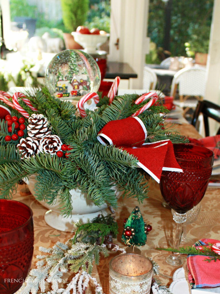 Snowy table center piece with French Country red and damask cloth