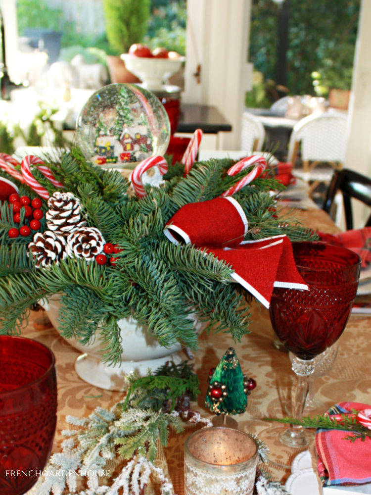 French Country holiday tablesetting with fresh evergreen centerpiece