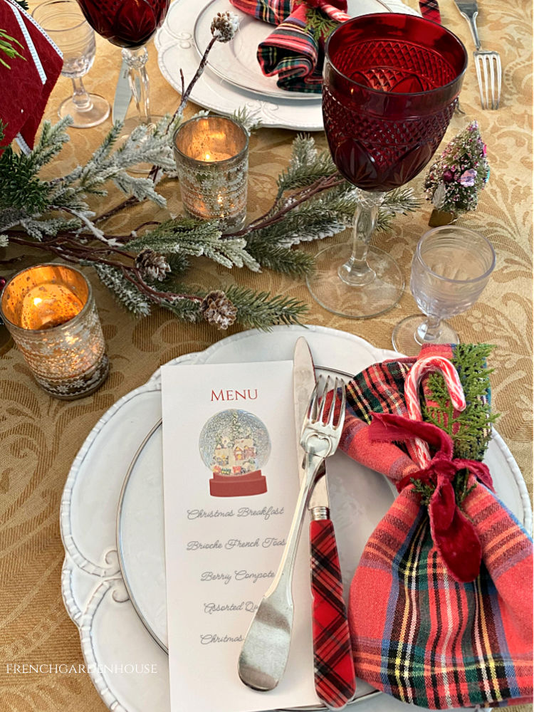 Holiday table setting with plaid napkins