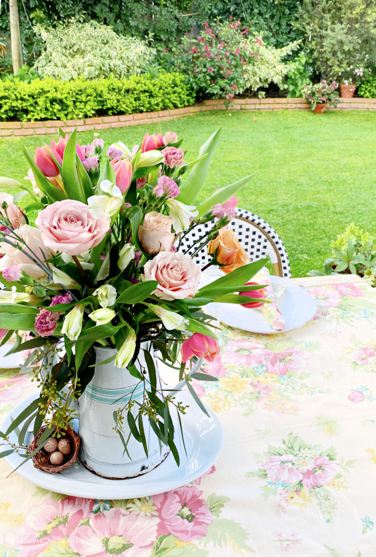 Easter flowers in antique French enamel pot