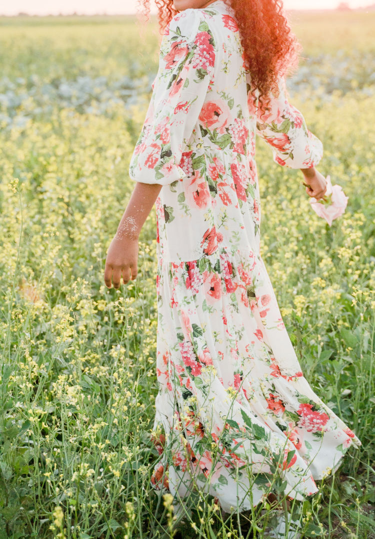 beautiful woman dancing in field