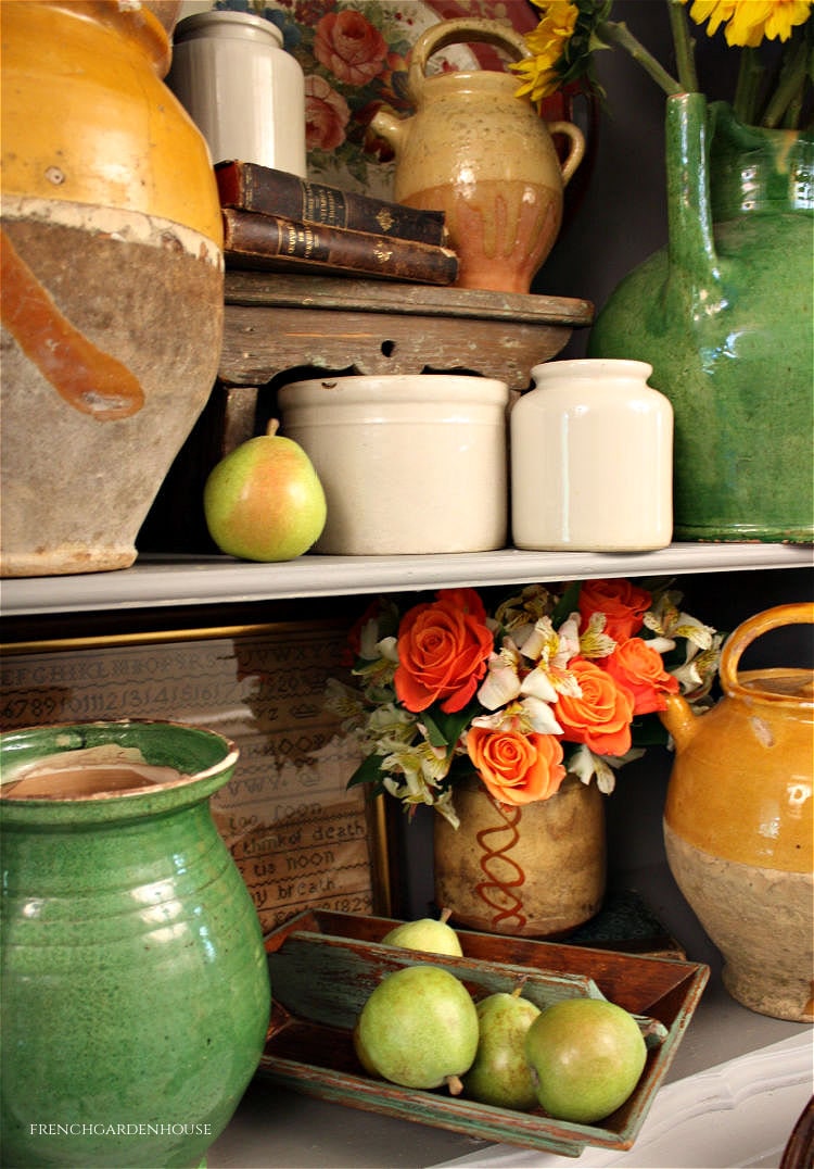 Antique armoire with French pottery