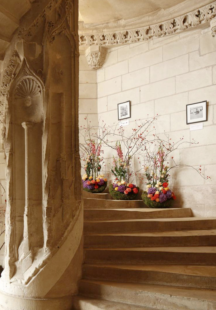 chateau stairs with floral displays